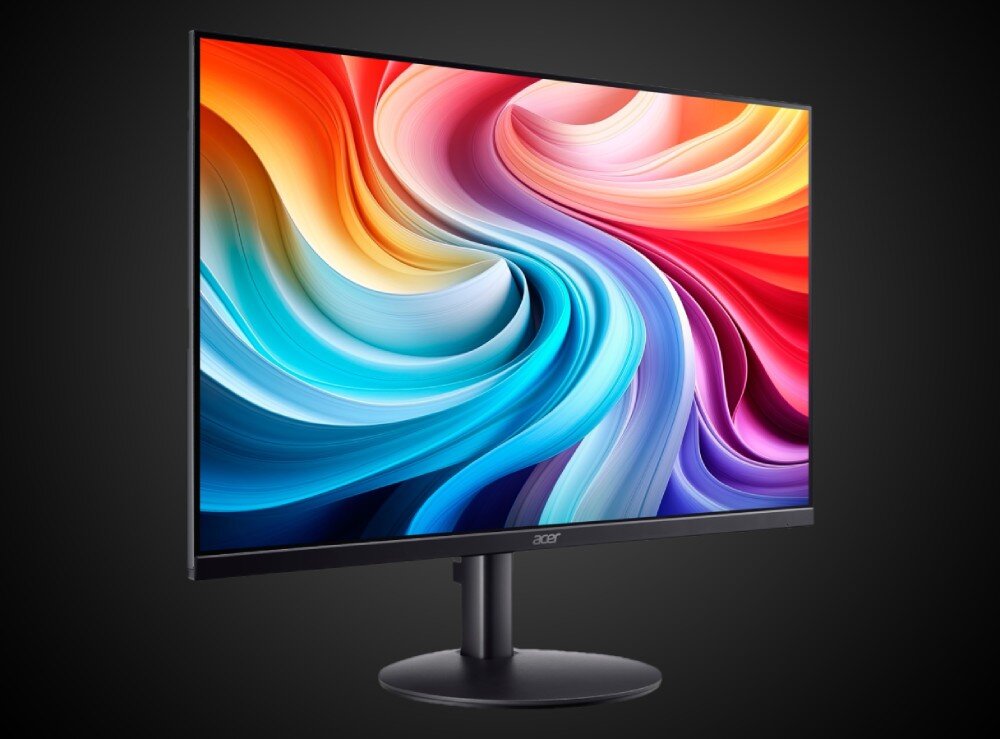 Monitor ACER SA243YG0 Kolorowy ekran monitora na czarnym tle. Wyświetlany obraz przedstawia abstrakcyjne, wirujące pasma barw w odcieniach czerwieni, niebieskiego, fioletu i pomarańczu. Monitor stoi na okrągłej podstawie, opis