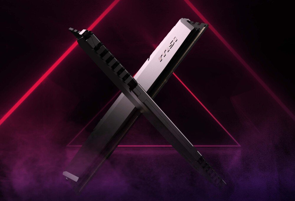 Komputer MSI MPG Trident AS 14NUC5-652EU Dwie kości pamięci komputerowej ustawione ukośnie na kolorowym tle, z widocznymi stykami i logo producenta, pamięć, dysk, pojemność, szybkość