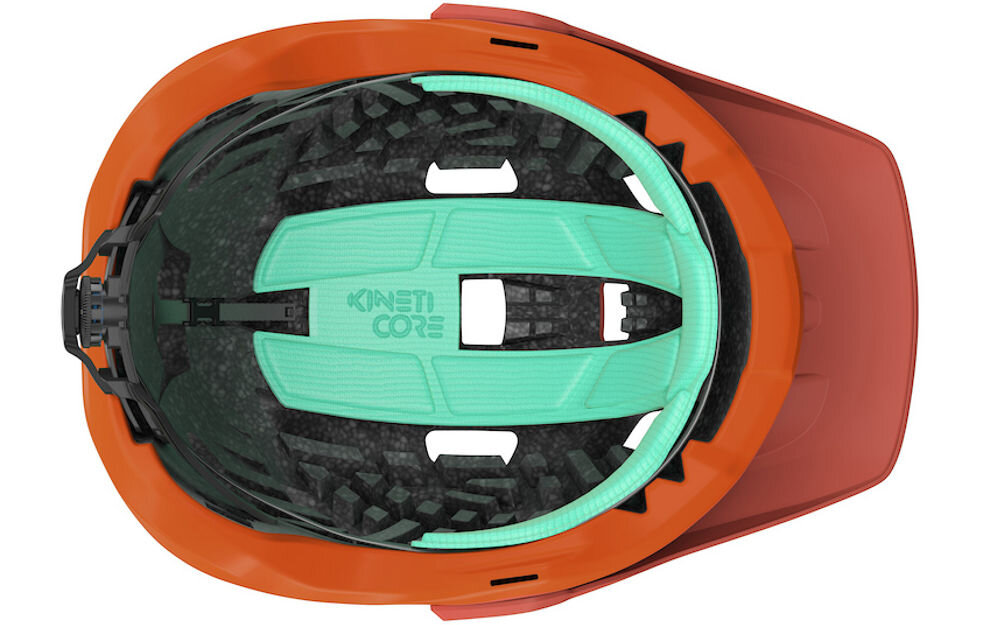 Kask rowerowy LAZER Jackal KinetiCore Pomarańczowy MTB (rozmiar M) widok od spodu wypełnienie kineticore niska waga niskie obciażenie mniej plastiku
