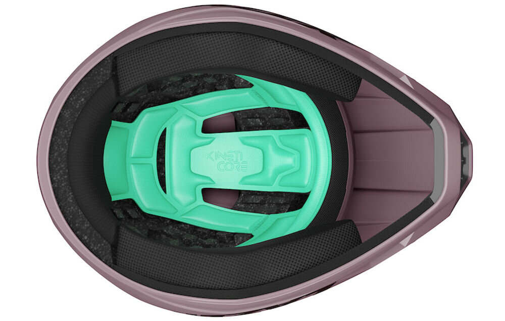 Kask rowerowy LAZER Chase KinetiCore Wnętrze kasku Lazer Cage z widoczną zieloną technologią KinetiCore i miękkimi wyściółkami policzkowymi