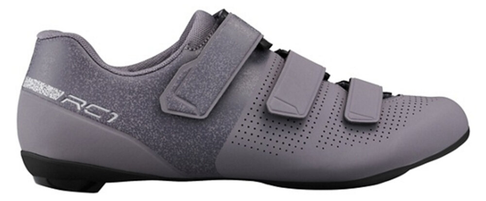 Buty rowerowe SHIMANO SH-RC102 Fioletowy rozmiar 39 but na jasnym tle widoczny z boku trzy praktyczne paski na rzepy umieszczone odwrotnie względem podbicia stabilność komfort noszenia stopa leży pewnie w bucie