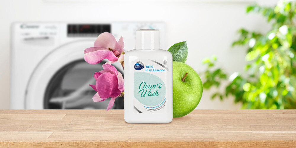 PERFUMY DO PRALKI CARE+PROTECT zdjęcie lifestyle butelka kwiaty pralka w tle zieleń roślina świeżość róża taif magnolia biała brzoskwinia zielone jabłko drzewna baza delikatny zapach