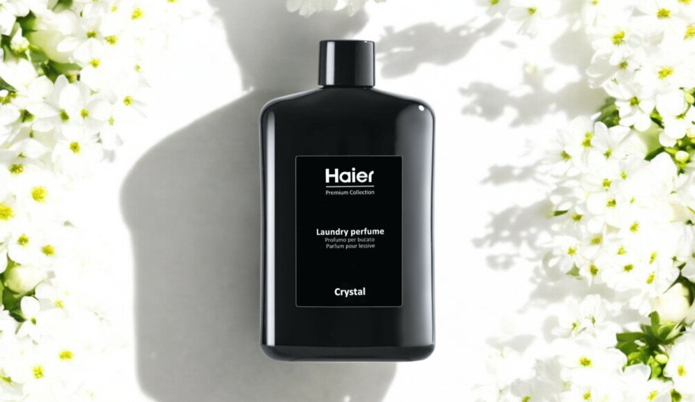 Perfumy do prania HAIER Crystal HPCC1040 400 ml zdjęcie lifestyle wizualizacja produktu opakowanie butelka front białe kwiaty jasne tło Zmysłowa świeżość prania Orzeźwiająca mork bryza soczysta słodka pomarańcza zielone nuty trwałość głębia róża damasceńska białe kwiaty Aktywna świeżość nierozpuszczalna formuła stopniowe uwalnianie Skoncentrowana intensywność zmiękczanie tkanin bez plam