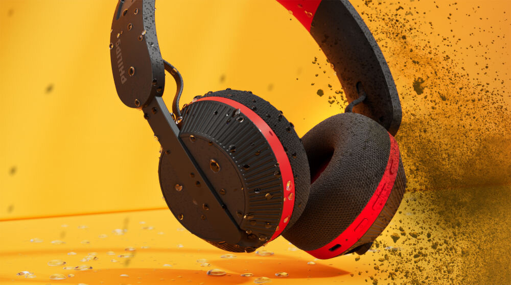 Słuchawki PHILIPS TAA6219BK/00 odporne na pot IP55 outdoor, słuchawki nauszne z kroplami wody i kurzem na żółtym tle