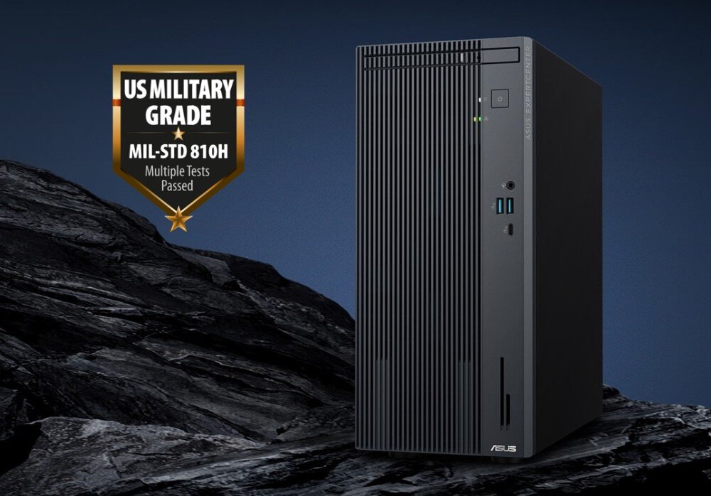 Komputer ASUS ExpertCenter P500MV-13420H057X Czarna obudowa komputera stojąca na skalnym tle obok emblematycznej plakietki z napisem 'US Military Grade MIL-STD 810H Multiple Tests Passed', testy, wytrzymałość, żywotność
