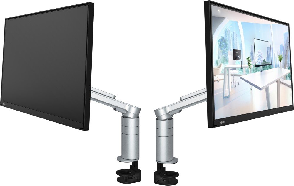 Monitor EIZO FlexScan FLT-BK Dwa monitory zamocowane na ramionach, ustawione przodem do siebie. Na jednym ekranie wyświetlony widok jasnego biura z dużymi oknami i miastem w tle, obraz, rozdzielczość, jasność, kolory