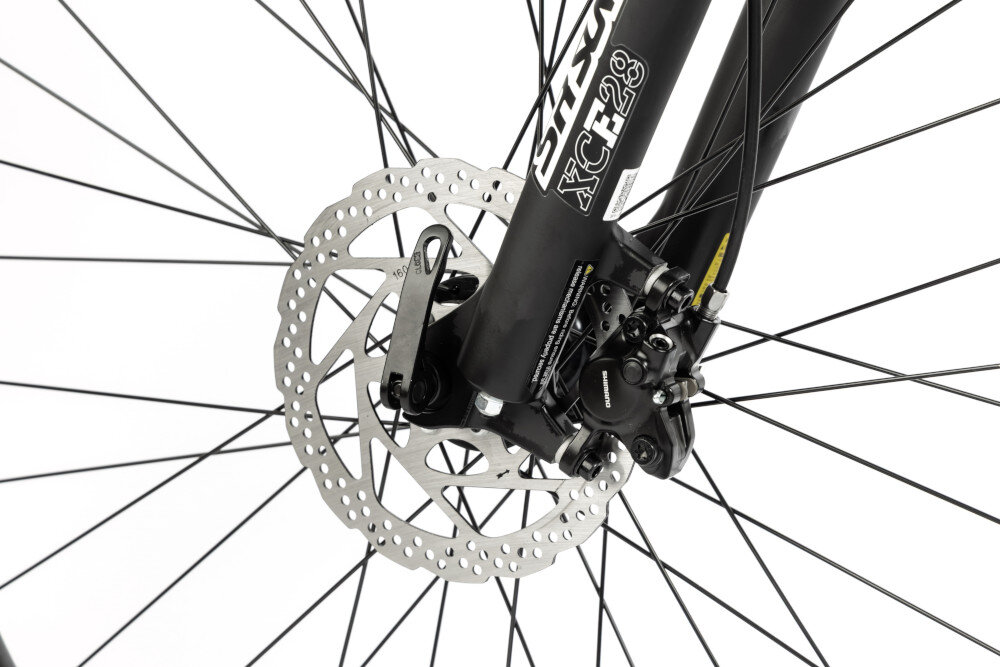 Rower górski MTB INDIANA X-Pulser 2.9 M21 29 cali męski Zielony zbliżenie na tarczę hamulcową podstawa bezpieczeństwa hamulce tarczowe hydrauliczne duża siła hamowania w każdych warunkach pogodowych i na każdej trasie płyn hamulcowy hamulce z przodu i z tyłu podwójny pakiet bezpieczeństwa