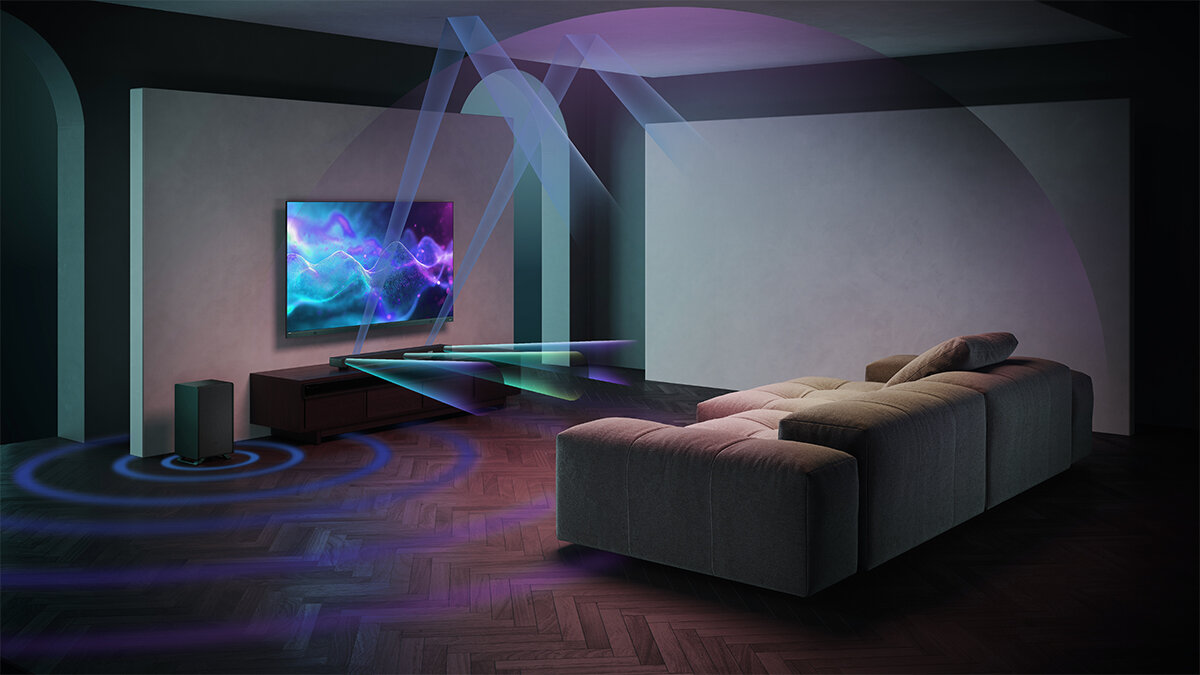 Soundbar SHARP HT-SBW53121 przestrzenny dźwięk subwoofer moc 550W, soundbar stojący na szafce pod zawieszonym telewizorem w pomieszczeniu