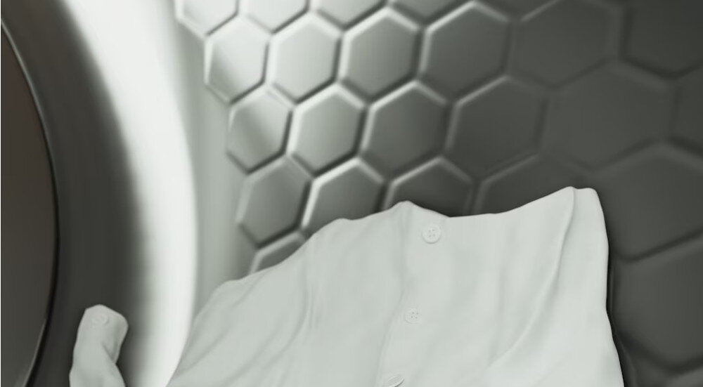 SUSZARKA MIELE TED645 WP wizualizacja wnętrze konstrukcja bębna poduszki plaster miodu biała bluzka odzież równomierne suszenie amortyzacja ubrań delikatnie mniej zagnieceń Bęben SoftCare