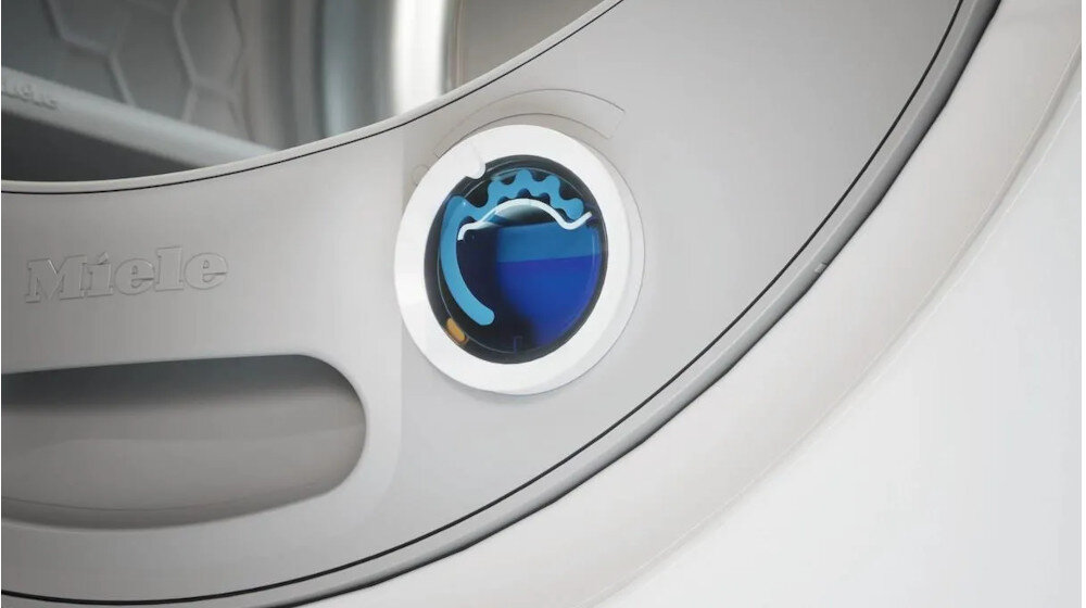 SUSZARKA MIELE TED645 WP wizualizacja zbliżenie miejsce na kapsułkę zapachową kolor niebieski System zapachowy FragranceDos kontrola intensywności całkowite wyłączenie zapachu