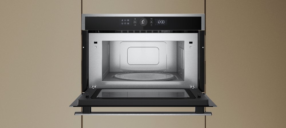 KUCHNIA MIKROFALOWA WHIRLPOOL WMD54MX lifestyle front otwarta wnętrze wykonanie design panel pokrętło cechy dodatkowe możliwości funkcje Pokrętło 6. Zmysł 7 poziomów mocy Design - kolor inox czarny Wnętrze stal nierdzewna pojemna komora pojemność 31 L