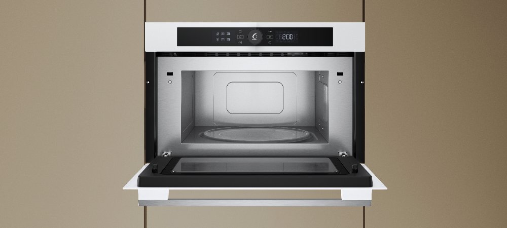 KUCHNIA MIKROFALOWA WHIRLPOOL WMD54MW lifestyle front otwarta wnętrze wykonanie design panel pokrętło cechy dodatkowe możliwości funkcje Pokrętło 6. Zmysł 7 poziomów mocy Design - kolor biały Wnętrze stal nierdzewna pojemna komora pojemność 31 L