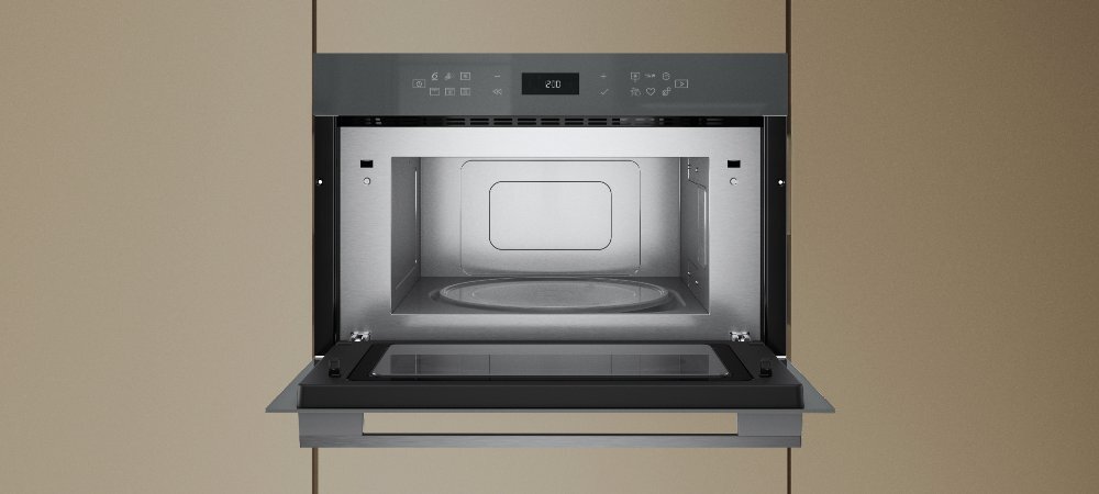 KUCHNIA MIKROFALOWA WHIRLPOOL WMD7O4TSG lifestyle front otwarta wnętrze wykonanie design panel pokrętło cechy dodatkowe możliwości funkcje Pokrętło 6. Zmysł 7 poziomów mocy Design - kolor inox Wnętrze stal nierdzewna pojemna komora pojemność 31 L