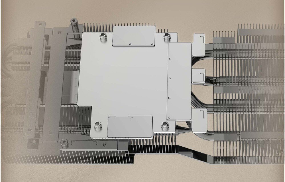 Karta graficzna MSI GeForce RTX 5070 Ti Inspire 3X OC Plus 16GB Widok wewnętrznej struktury radiatora karty graficznej z centralnie umieszczoną metalową płytą bazową i rozchodzącymi się rurkami cieplnymi, baza chłodząca, ciepłowody, radiator