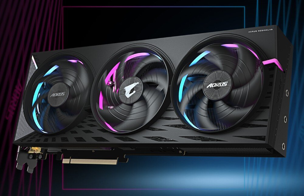 Karta graficzna GIGABYTE Aorus Radeon RX 9070 XT Elite 16GB Karta graficzna z trzema wentylatorami z podświetleniem w kolorach różowym i niebieskim, przedstawiona na tle gradientu niebiesko-fioletowego, chłodzenie, wentylatory, temperatura