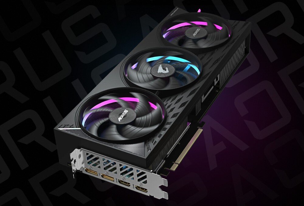 Karta graficzna GIGABYTE Aorus Radeon RX 9070 XT Elite 16GB Widok karty graficznej z trzema wentylatorami i czterema portami wideo, w tym dwoma HDMI i dwoma DisplayPort, na tle z motywem graficznym, komponenty, wytrzymałość, produkcja