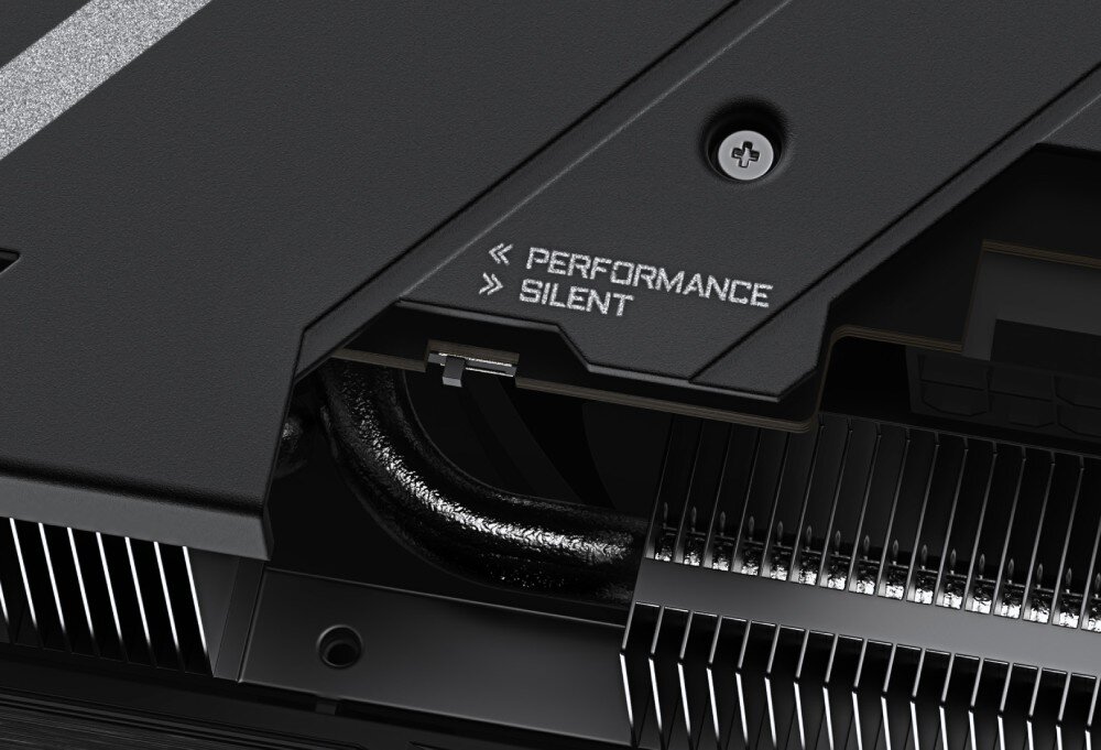 Karta graficzna GIGABYTE Aorus Radeon RX 9070 XT Elite 16GB Przełącznik trybu pracy karty graficznej z oznaczeniami 'Performance' i 'Silent', umieszczony obok radiatora, funkcja Dual BIOS, tryby działania