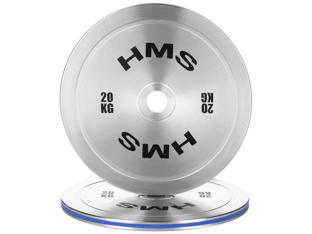 Obciążenie HMS TOS200 (20 kg) obciążenie na białym tle widoczne od przodu ustawione na drugim obciążeniu obciążenie olimpijskie o masie 20 kg wspiera precyzyjne budowanie siły i techniki stopniowe zwiększanie obciążenia bez gwałtownych przeskoków ułatwia kontrolę postępów i zmniejsza ryzyko przeciążenia