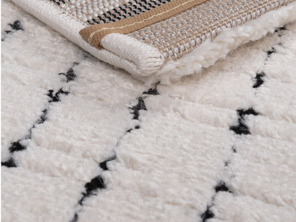 Dywan wewnętrzny MULTIDECOR Elio Linie 508386 200 x 290 cm Kremowo-czarny, salon, sypialnia, gabinet, uniwersalny, zbliżenie na miękki materiał dywanu oraz spód dywanu