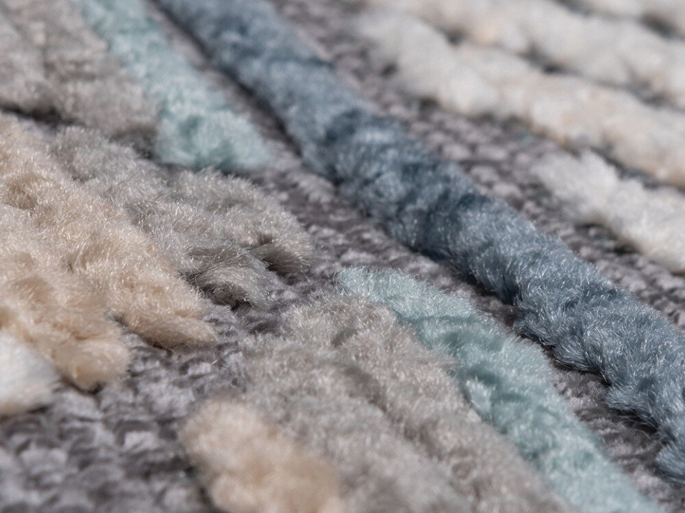 Dywan MULTIDECOR Nepal 120 x 180 cm Pasy Niebieski, efekt, 3D, światło, solidny, zbliżenie na materiał z którego został wykonany dywan
