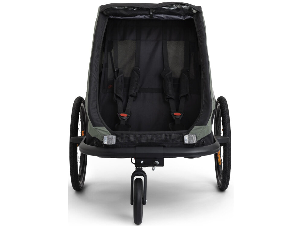 Przyczepka rowerowa HAMAX Traveller Twin Khaki-czarny przyczepka na białym tle widoczna od przodu Regulowane 5-punktowe pasy bezpieczeństwa pomaga ograniczyć przemieszczanie się dziecka stabilne podparcie hamulec postojowy stabilna po zaparkowaniu