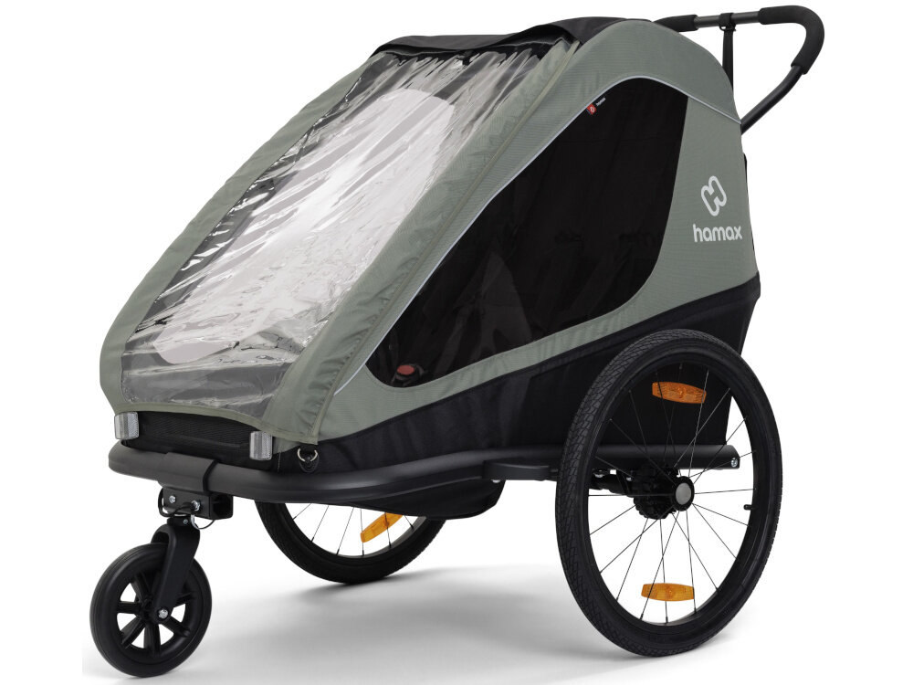 Przyczepka rowerowa HAMAX Traveller Twin Khaki-czarny przyczepka na bialym tle widczna pod skosem Zintegrowana osłona przeciwsłoneczna Duże okna wpuszczają światło do wnętrza Górne okienko Połączenie osłony i przeszklonych powierzchni