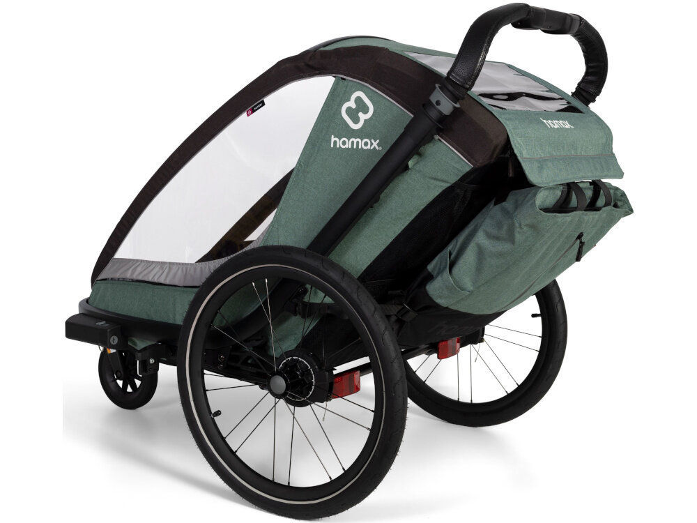 Przyczepka rowerowa HAMAX Cocoon One Zielono-czarny przyczepka na białym tle widoczna od tyłu pod skosem Maksymalna waga dzieci wynosi do 22 kg waga całkowita dziecka i bagażu to 35 kg Maksymalny wzrost dziecka określono na 117 cm minimalny wiek użytkownika w trybie rowerowym to około 9 miesięcy dziecko musi samodzielnie siedzieć zatwierdzony zgodnie z EN15918 i EN1888 Koła z odblaskowymi paskami lampka Presto z baterią CR2032