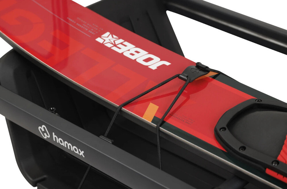 Przyczepka rowerowa HAMAX Venture+ 400702 zbliżenie na haki i gumki cztery haki gumkę do mocowania ładunku Haki można rozmieszczać w różnych miejscach ramy Elastyczna gumka Pokrowiec ochronny na bagaż