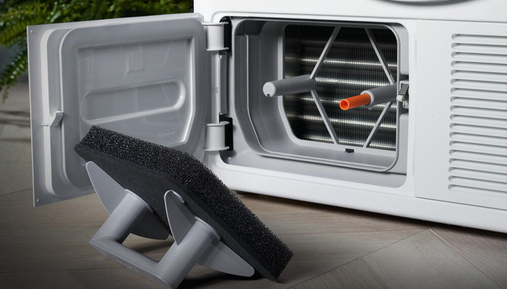 Suszarka MIELE TWA520WP EcoSpeed zdjęcie wizualizacyjne lifestyle otwarta klapka filtr konstrukcja Bezobsługowy wymiennik ciepła system filtrów ochrona niskie zużycie energii