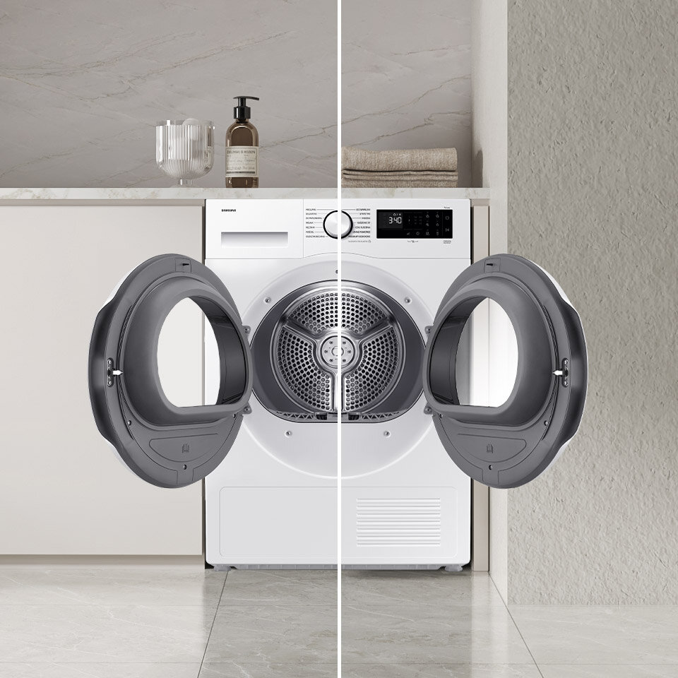 Obraz przedstawia suszarkę z otwartymi drzwiami, umieszczoną w nowoczesnym wnętrzu. Na blacie nad suszarką znajdują się butelka z pompką i szklany pojemnik.