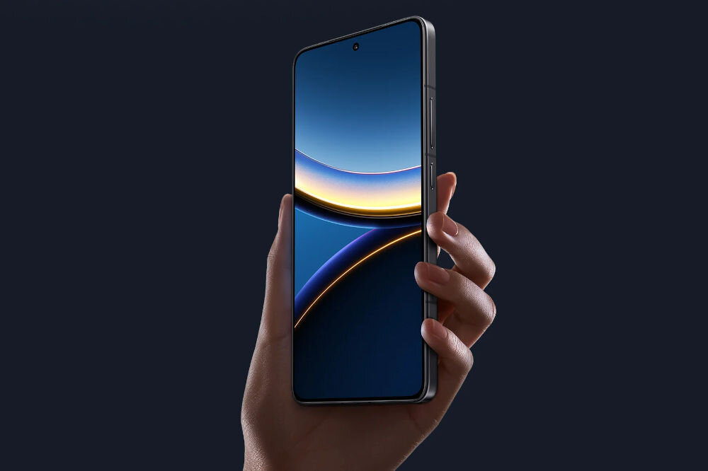 Smartfon XIAOMI Poco F7 Pro 5G 12/512GB 6.67 120Hz trzymany w dłoni z aktywnym wyświetlaczem amoled 6,6 cala 2k 120 hz 3200 nitów jasność ciemna ramka 1,9 mm 68 miliardów kolorów czułość 2560 Hz