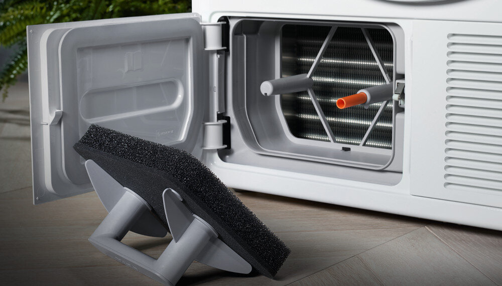 Suszarka MIELE TSH783WP EcoSpeed zdjęcie wizualizacyjne lifestyle otwarta klapka filtr konstrukcja Bezobsługowy wymiennik ciepła system filtrów ochrona niskie zużycie energii