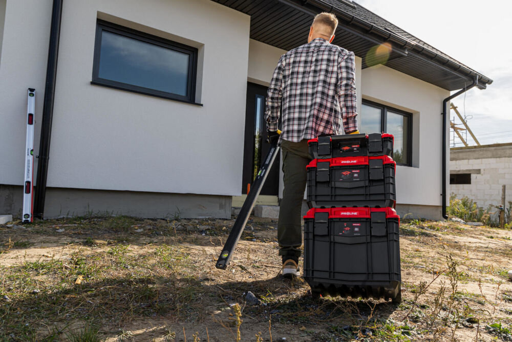 Skrzynka narzędziowa ABS PRO 15 Proline 35770 - z wbudowaną miarą w centymetrach i calach na pokrywie - skrzynki ciągnięte przez osobę w stronę domu do wykończenia