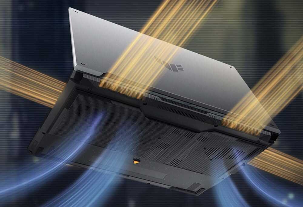 ASUS TUF Gaming F16 od spodu z efektami przepływu powietrza niebiesko-żółtymi na ciemnym tle z logo TUF, prezentującym system chłodzenia Arc Flow Fans z 84 łopatkami wentylatorów o zmiennej grubości i kanałami odprowadzania pyłu dla optymalnej termiki - 84-łopatkowe wentylatory Arc Flow