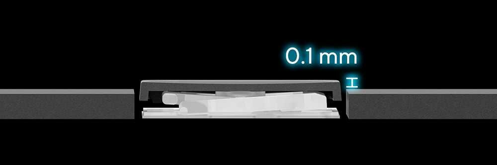 Przekrój boczny przez mechanizm klawisza laptopa ASUS VivoBook 17X, z podświetlonym oznaczeniem „0,1 mm” – wizualizacja minimalnej szczeliny pomiędzy klawiszem a obudową, co zapewnia płynność działania i ochronę przed kurzem. - odległość wciśniętej nasadki od obudowy 