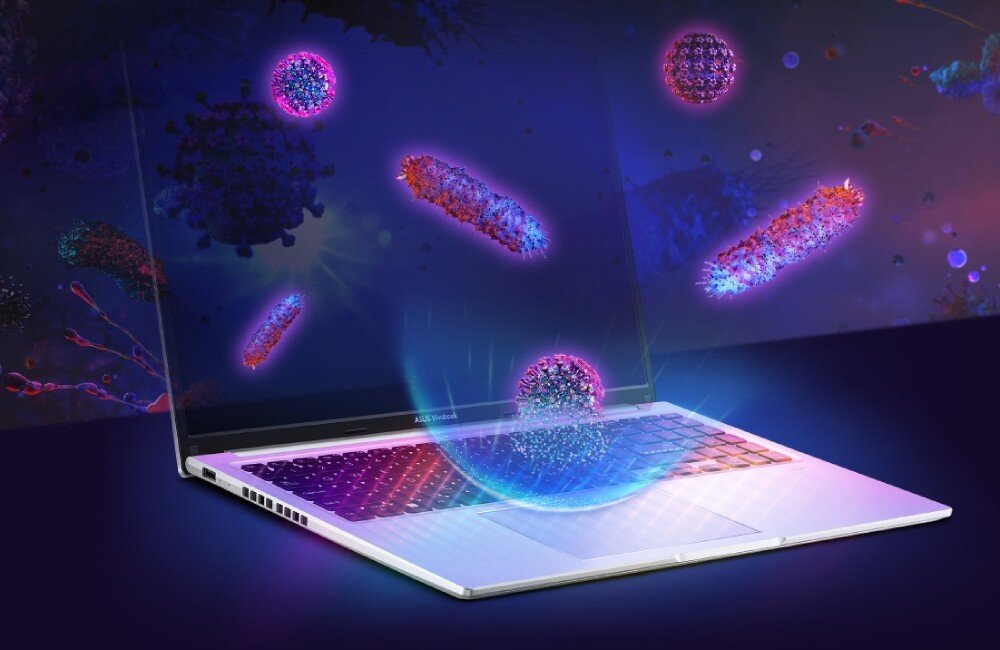 Grafika przedstawiająca laptop ASUS Vivobook 16 i unoszące się nad nim ilustracje drobnoustrojów, powłoka antybakteryjna
