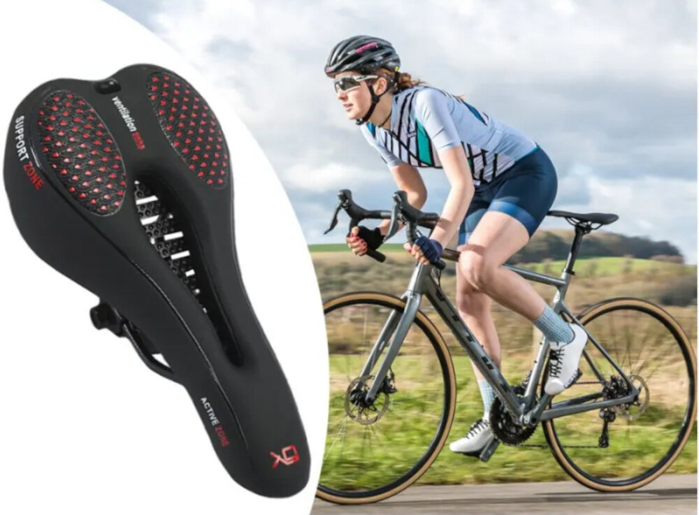 Siodełko EXTRALINK 14507 siodełko na białym tle obok osoba jedzie na rowerze po drodze w tle łąka wygoda komfort jazda rowerem