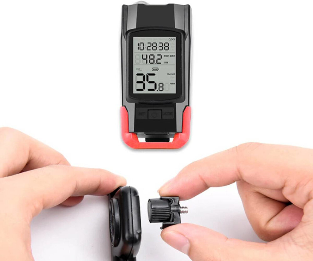 Zestaw lampek rowerowych EXTRALINK z licznikiem 14480 przednia lampka na białym tle poniżej osoba podłącza kontroler do licznika zasilane są akumulatorowo ładowanie odbywa się przez port micro-USB czas pracy wynosi około 3 do 6 godzin w zależności od wybranego trybu