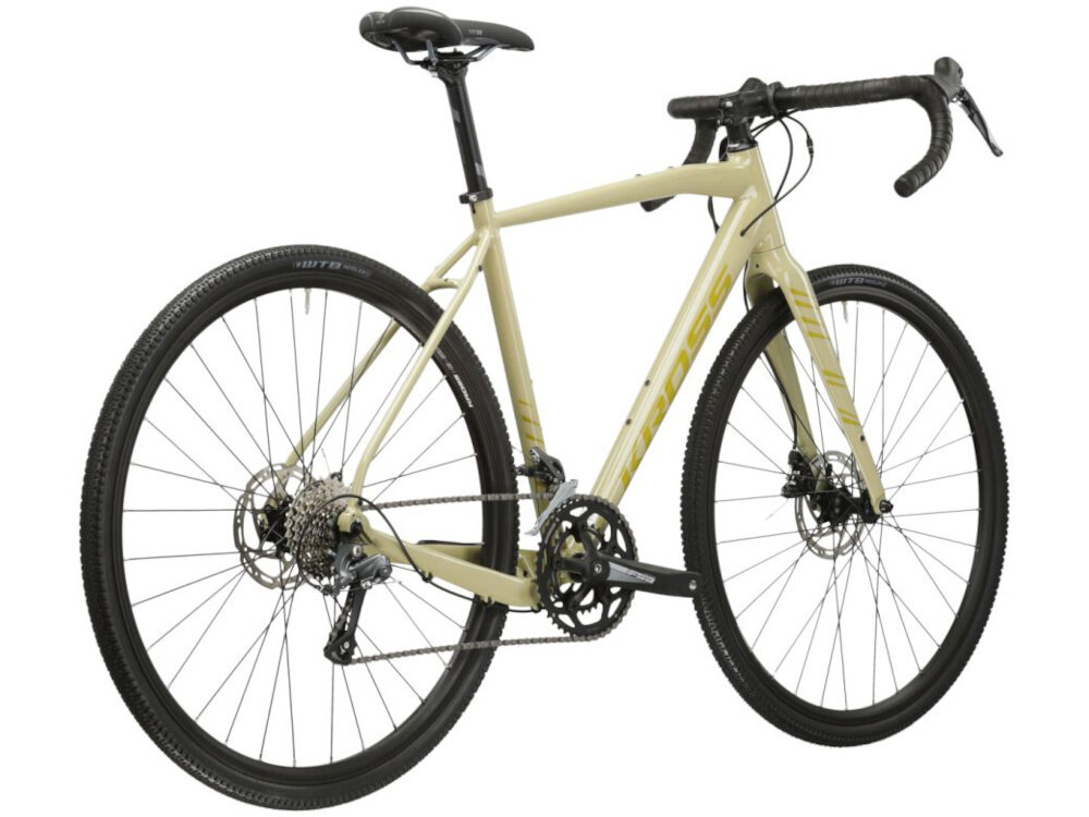 Rower gravel KROSS Esker 1.0 M22 28 cali męski Beżowo-złoty rower widoczny od tyłu pod skosem rower wyścigowy do jazdy wyczynowej osiąga wysokie prędkości maksymalnie zmniejszać opór powietrza pozbawiony jest zbędnych elementów
