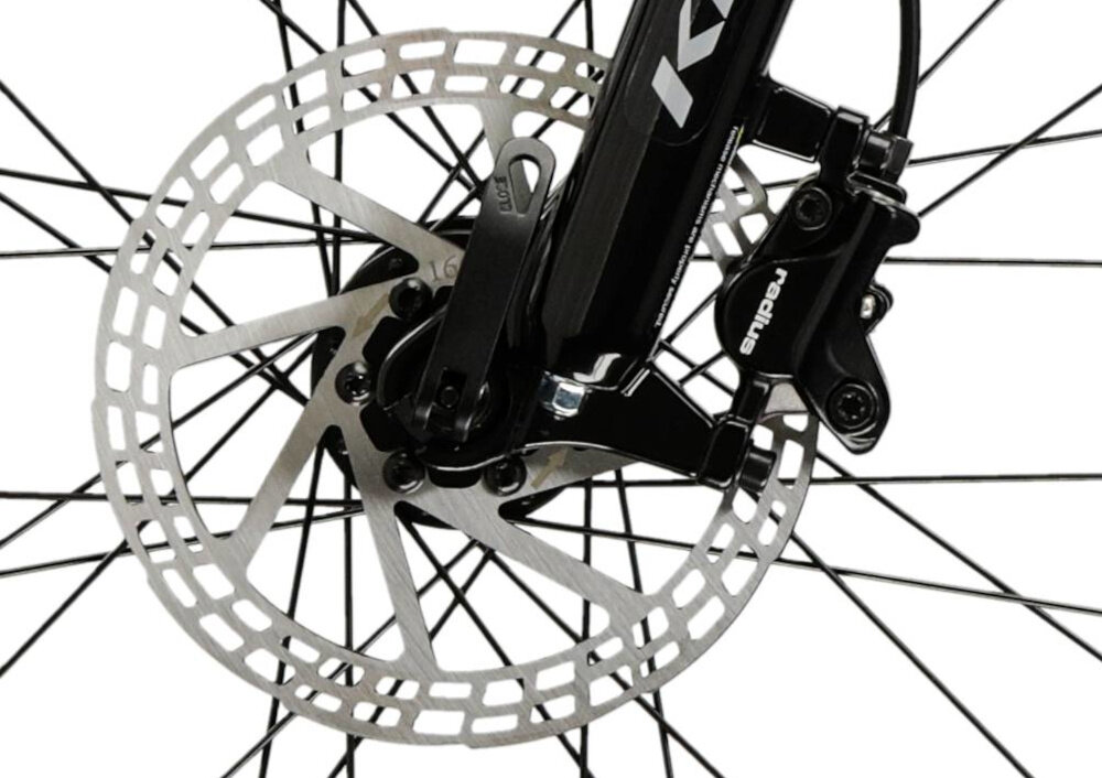 Zbliżenie na tarczę hamulcową roweru z widocznym zaciskiem i napisem \'radius\'.