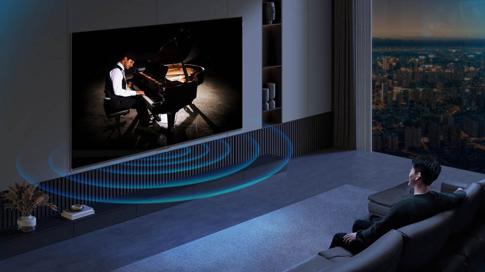 Telewizor TCL 50P79K - Mocny i czysty dźwięk, telewizor zawieszony na ścianie w salonie, wydobywający się dźwięk