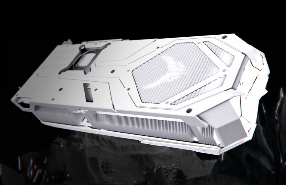 Karta graficzna POWERCOLOR Radeon RX 9070 XT Red Devil Spectral White 16GB Widok od strony backplate'u, pokazujący białą metalową osłonę z ażurowym wzorem i logotypem w centralnej części, PCB, układ zasilania