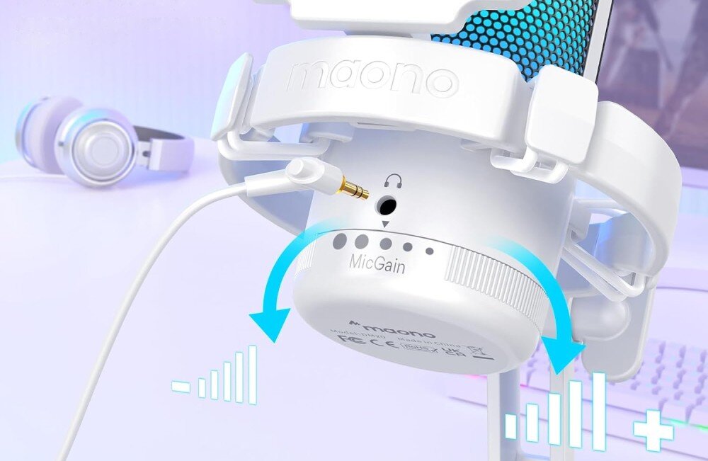 Mikrofon MAONO DGM20 Spód obudowy mikrofonu z pokrętłem 'Mic Gain' do regulacji czułości, wejściem słuchawkowym jack 3,5 mm i niebieskimi strzałkami wskazującymi kierunek obrotu