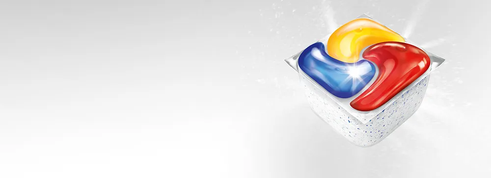 Czterokolorowa kapsułka do zmywarki Fairy Platinum Plus na jasnym tle i ikonami funkcji produktu.