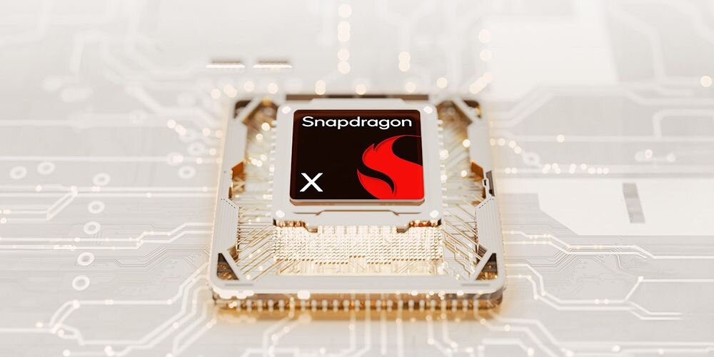 Procesor Snapdragon X z czerwonym logo NPU na płycie głównej laptopa ASUS Zenbook z widocznymi ścieżkami przewodzącymi i układami scalonymi do przetwarzania AI - Snapdragon X z dedykowanym układem NPU