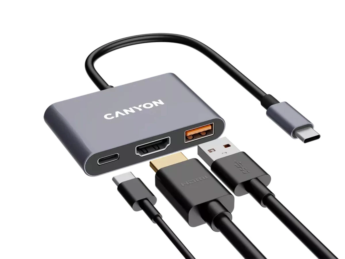 Szary hub USB-C z trzema portami: USB-C, HDMI i USB-A. Na urządzeniu widoczne jest logo \'CANYON\'.