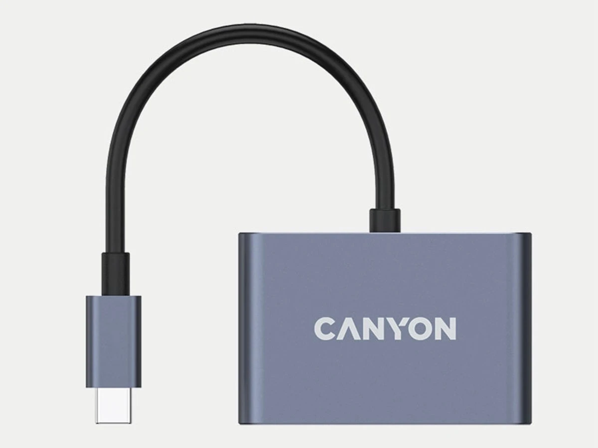 Szary adapter z logo \'CANYON\' na obudowie, z krótkim czarnym kablem zakończonym wtykiem USB-C.