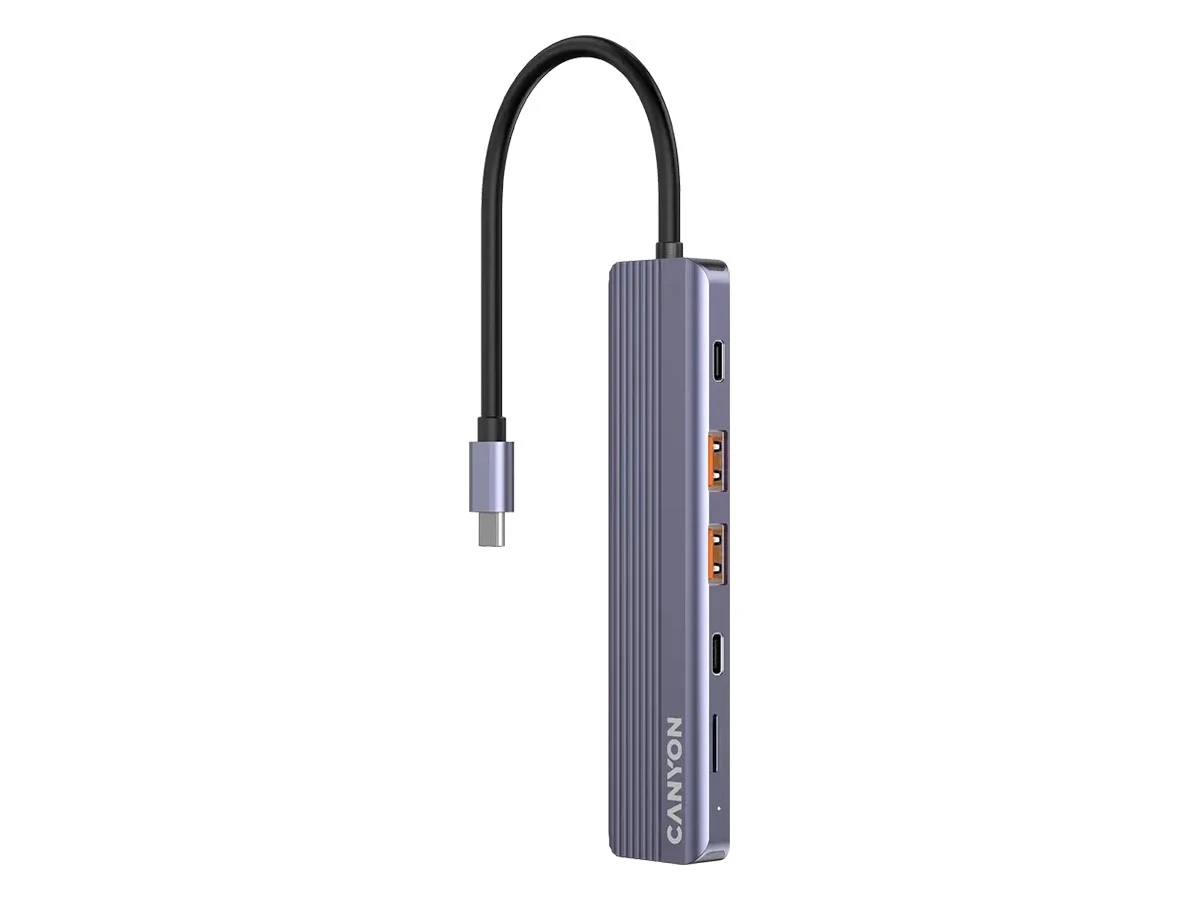 Szary hub USB-C z sześcioma portami, w tym dwoma USB i jednym HDMI. Na obudowie widoczne jest logo \'CANYON\'.
