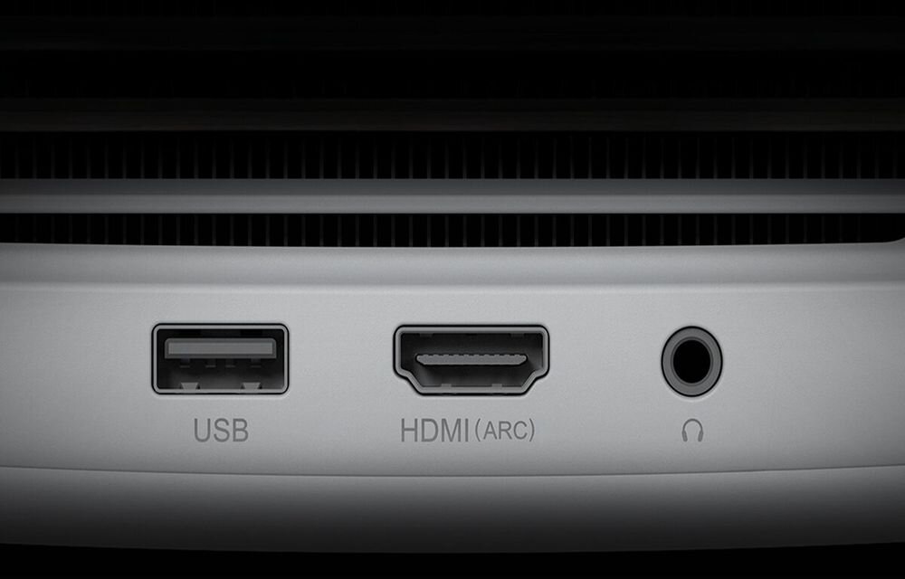 Obraz przedstawia panel z trzema portami: USB, HDMI (ARC) i gniazdo słuchawkowe, z widocznymi etykietami pod każdym z nich.
