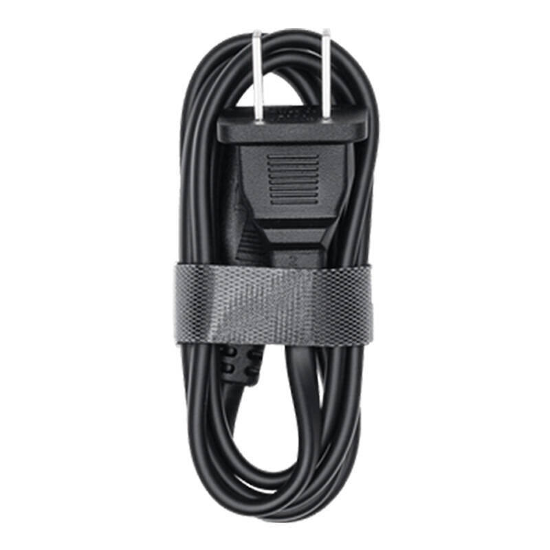 Czarny kabel z wtyczką elektryczną, zwinięty i zabezpieczony opaską z rzepem.